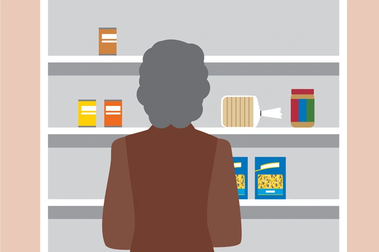 person standing in front of shelf with minimal food